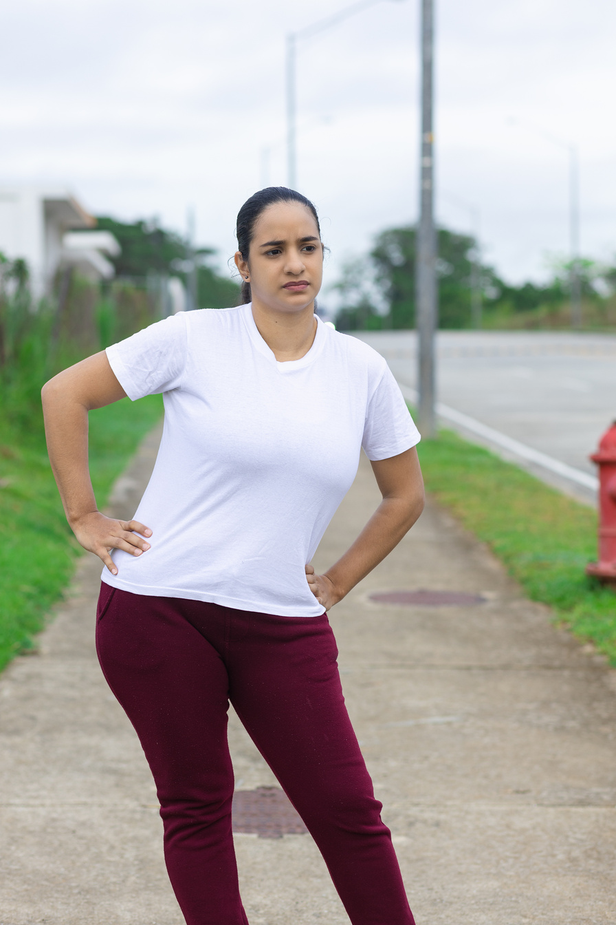latin woman doing hip stretch